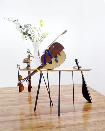 A flower vase and other instruments placed on the table