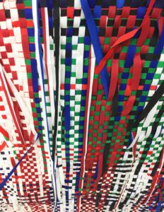 Colorful woven ribbons in red, green, white, blue