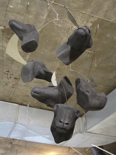 Hanging black bull head sculpture mobile