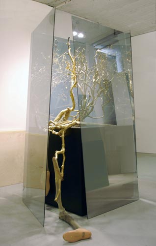 Golden Ho Bough, 2008, two-way mirrored glass, resin, wood, stockings, prosthetic limbs, 78”x38”x38”.