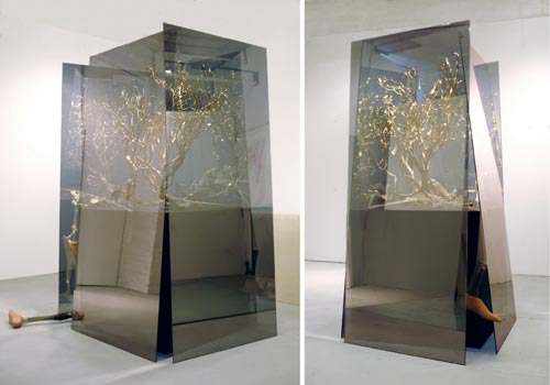Golden Ho Bough, 2008, two-way mirrored glass, resin, wood, stockings, prosthetic limbs, 78”x38”x38”.