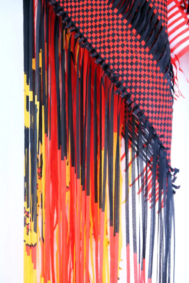 A close up of the fringes on a wall